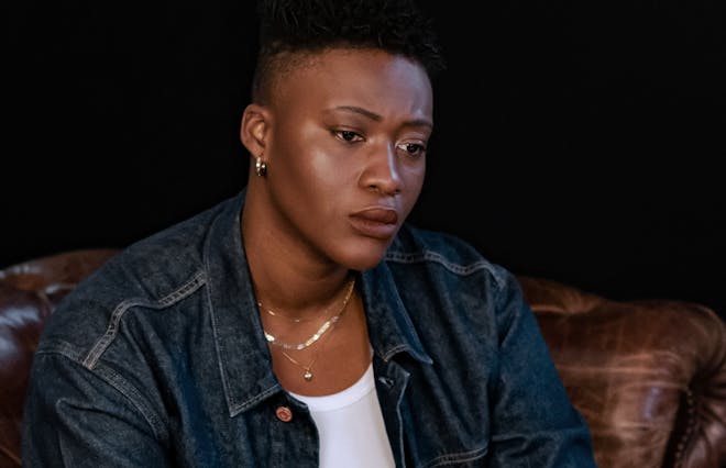 A non binary person thinking in therapy