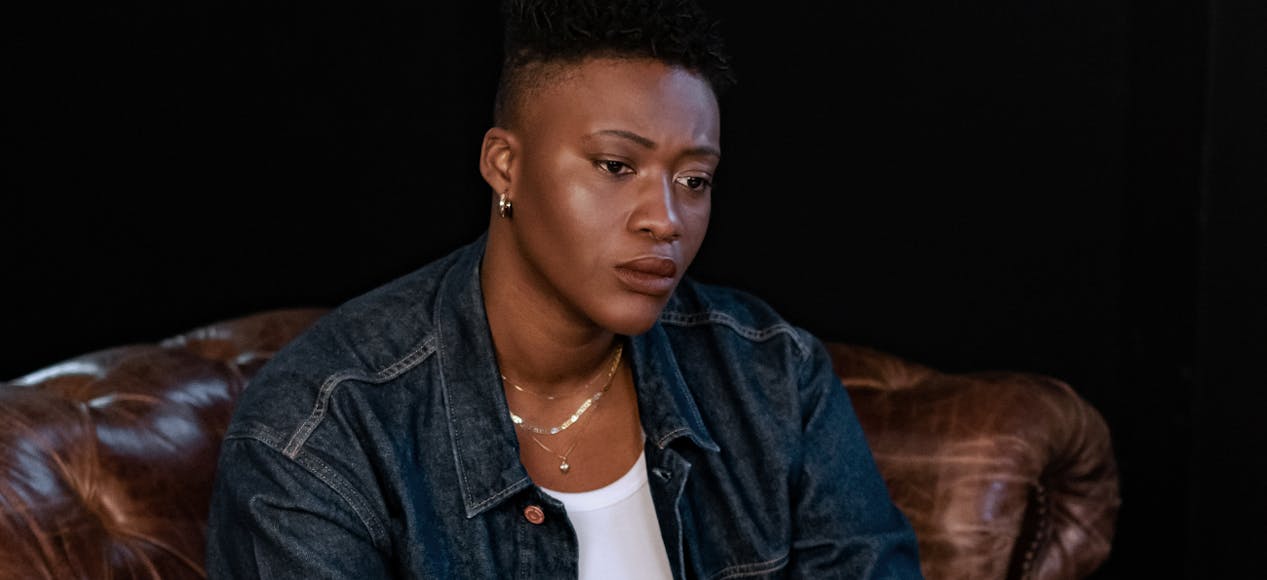A non binary person thinking in therapy